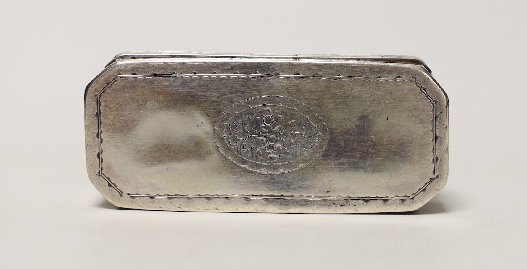 An early 19th century Dutch? engraved white metal rectangular snuff box, with canted corners, 84mm, 103 grams.